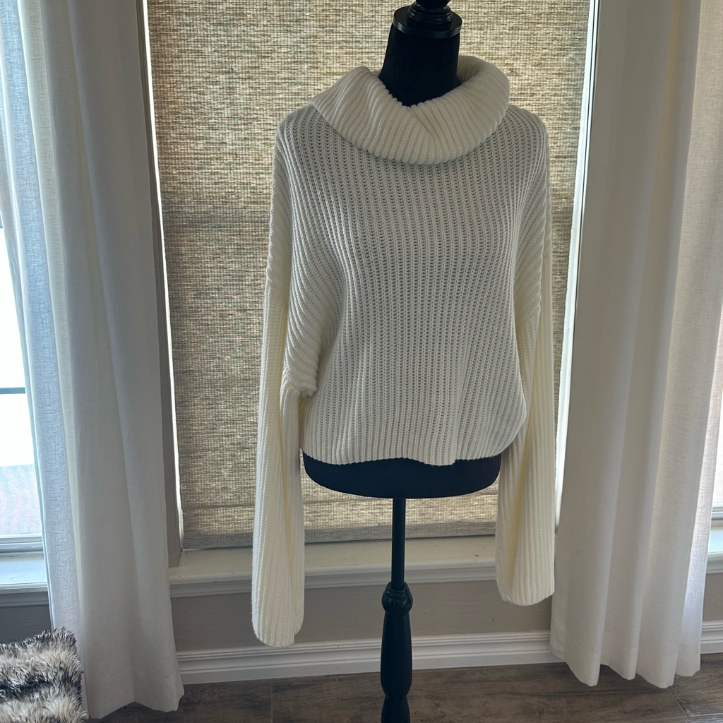 Cozy Cream Turtleneck Sweater With Oversized Sleeves Perfect For Rolling.
